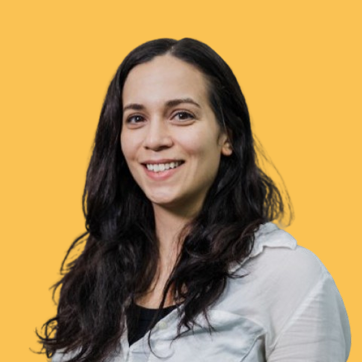 A headshot of Lauren Mastroni on a yellow background.